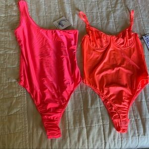 Two neon bodysuits